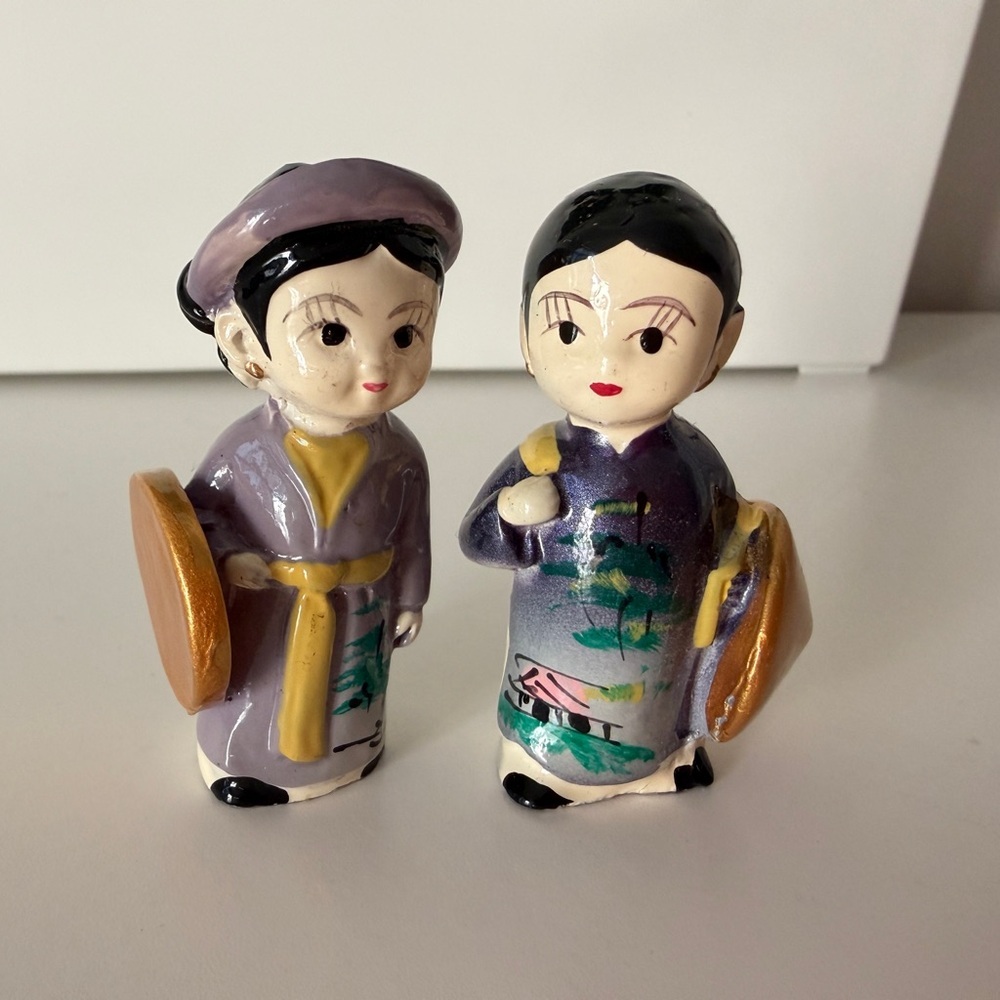 Charming Ceramic Figurines in Traditional Dress